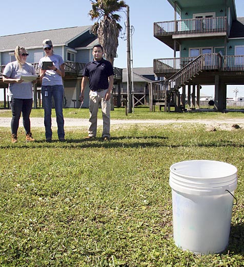 A recon team made up of Gustavson (center), TCEQ environmental investigator Nicole Foster, and Hernandez, enter information about a simulated hazmat container into the Response Manager database.