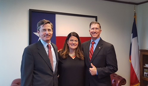 Commissioner Emily Lindley (center) is flanked by two chairmen—new Chairman Jon Niermann (left) and retired Chairman Bryan W. Shaw.