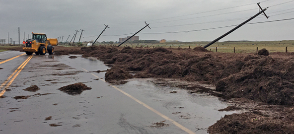 A loader is used to clear debris from Hurricane Harvey near Port Aransas.