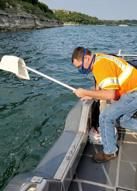 Chris Keffer follows CDC best management practices while responding to a boat fire/sunken boat on Lake Travis.