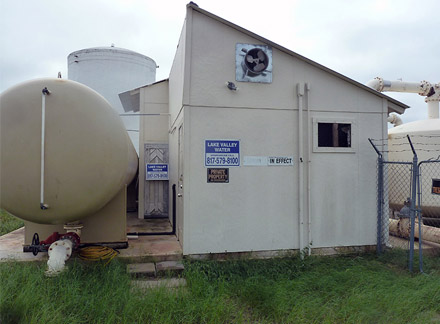 Facility entrance and ground storage tanks.