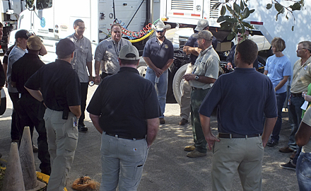 Director of TCEQ's Critical Infrastructure Division, Kelly Cook, sixth from the left, address emergency responders before they deployed to hurricane-stricken areas.