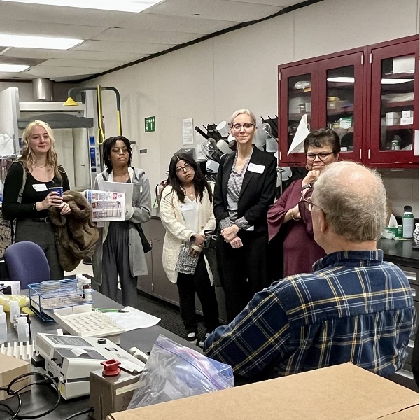 Students talking to the person at office