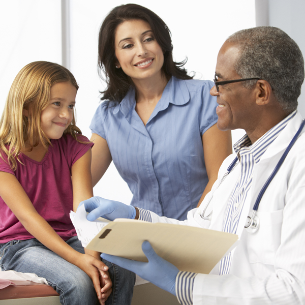 A mother and daughter talking to a doctor