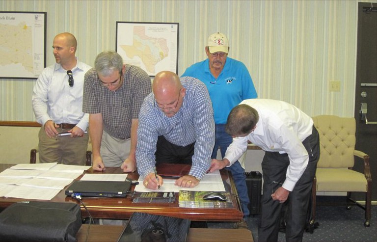 Lake O' the Pines stakeholders sign in photo 19