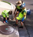Part of the team out in the field, marking a storm drain.  Thumbnail Image